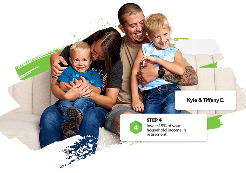 Smiling family snuggled on a couch—debt-free, secure, and investing for their future.
